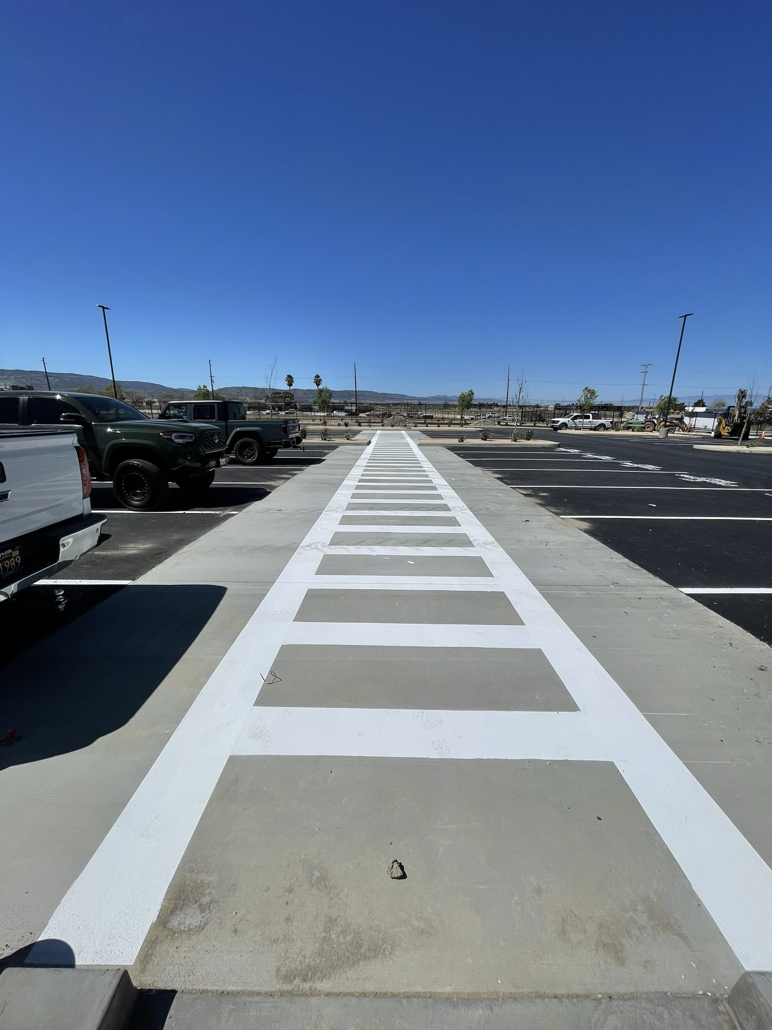 A parking lot with white lines painted on it.